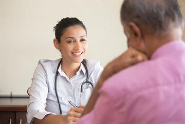 Female doctor consulting with patient