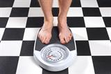 Overweight man on scales