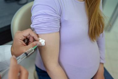 Pregnant woman receiving vaccine