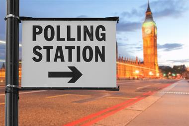 Polling station sign with Houses of Parliament in the background