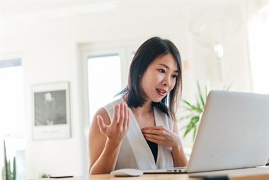 Female GP looking at computer screen