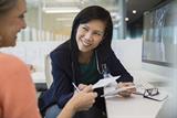 Female doctor in discussion with a female patient